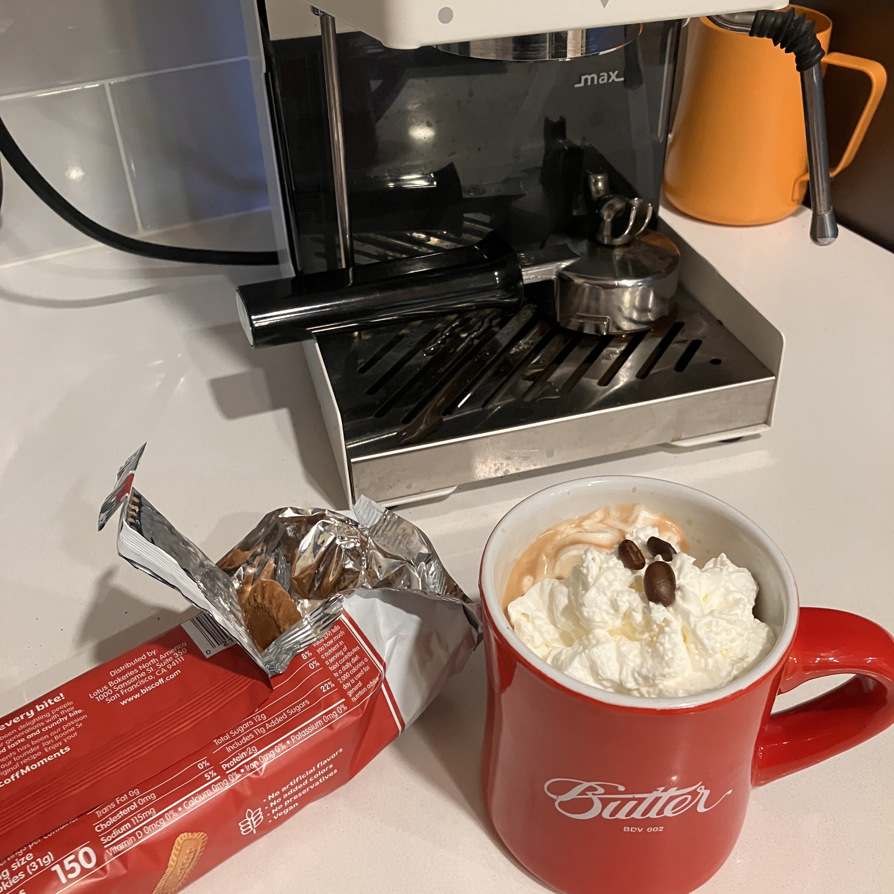 Espresso with whipped cream and Biscoff cookies