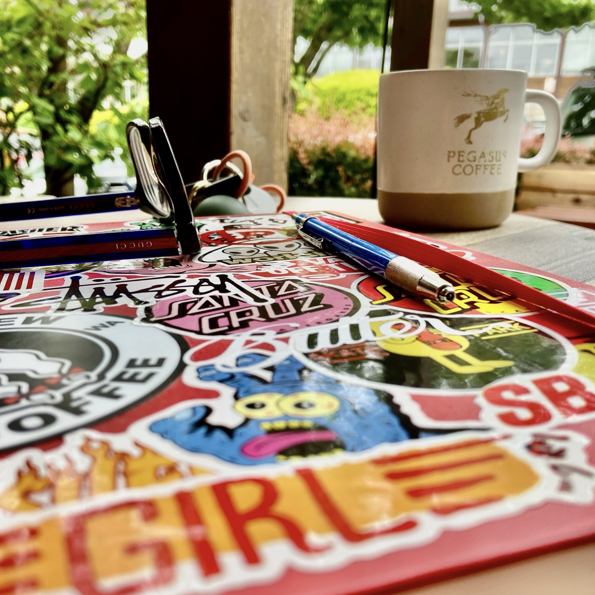 Sketchbook with coffee and keys