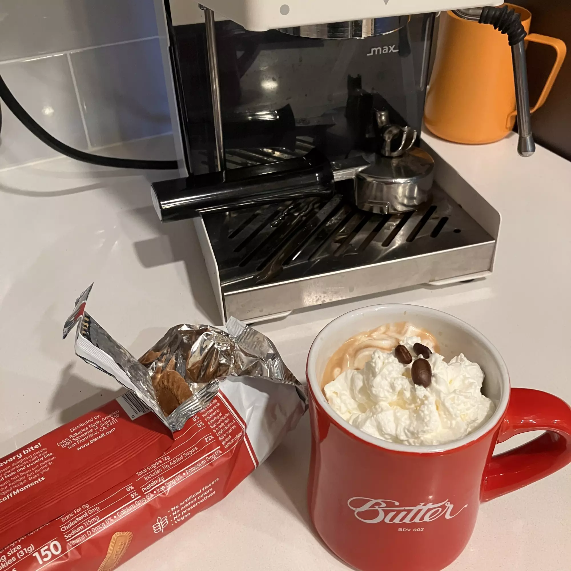 Espresso with whipped cream and Biscoff cookies