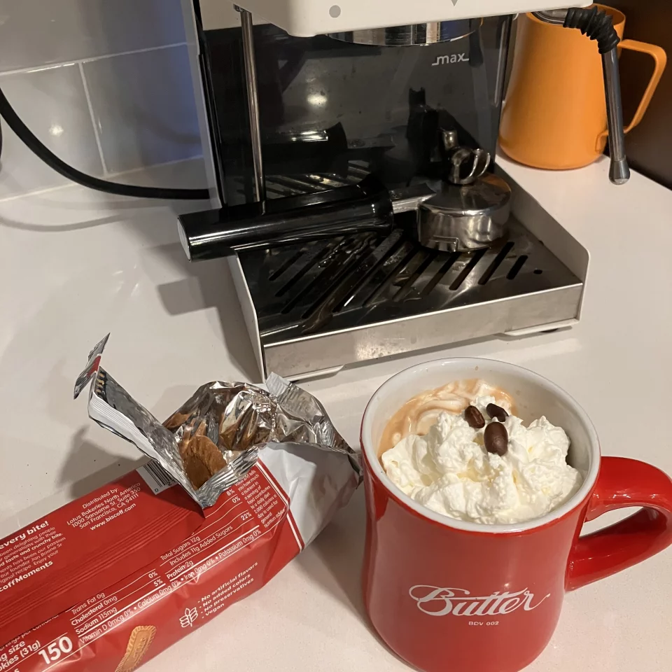 Espresso with whipped cream and Biscoff cookies