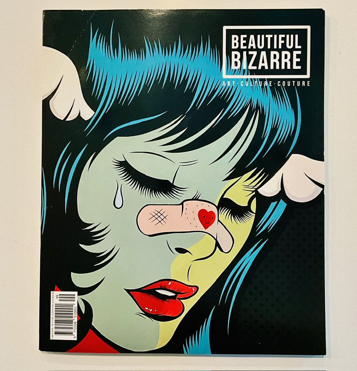 Photo of the cover of Beautiful Bizarre magazine on my kitchen counter.