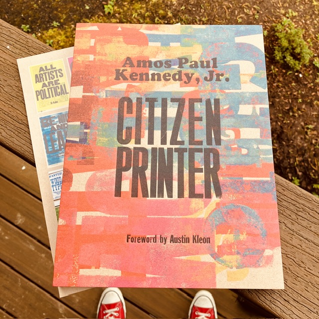 Cover for *Citizen Printer* with insert behind showcasing the “All artists are political” print.