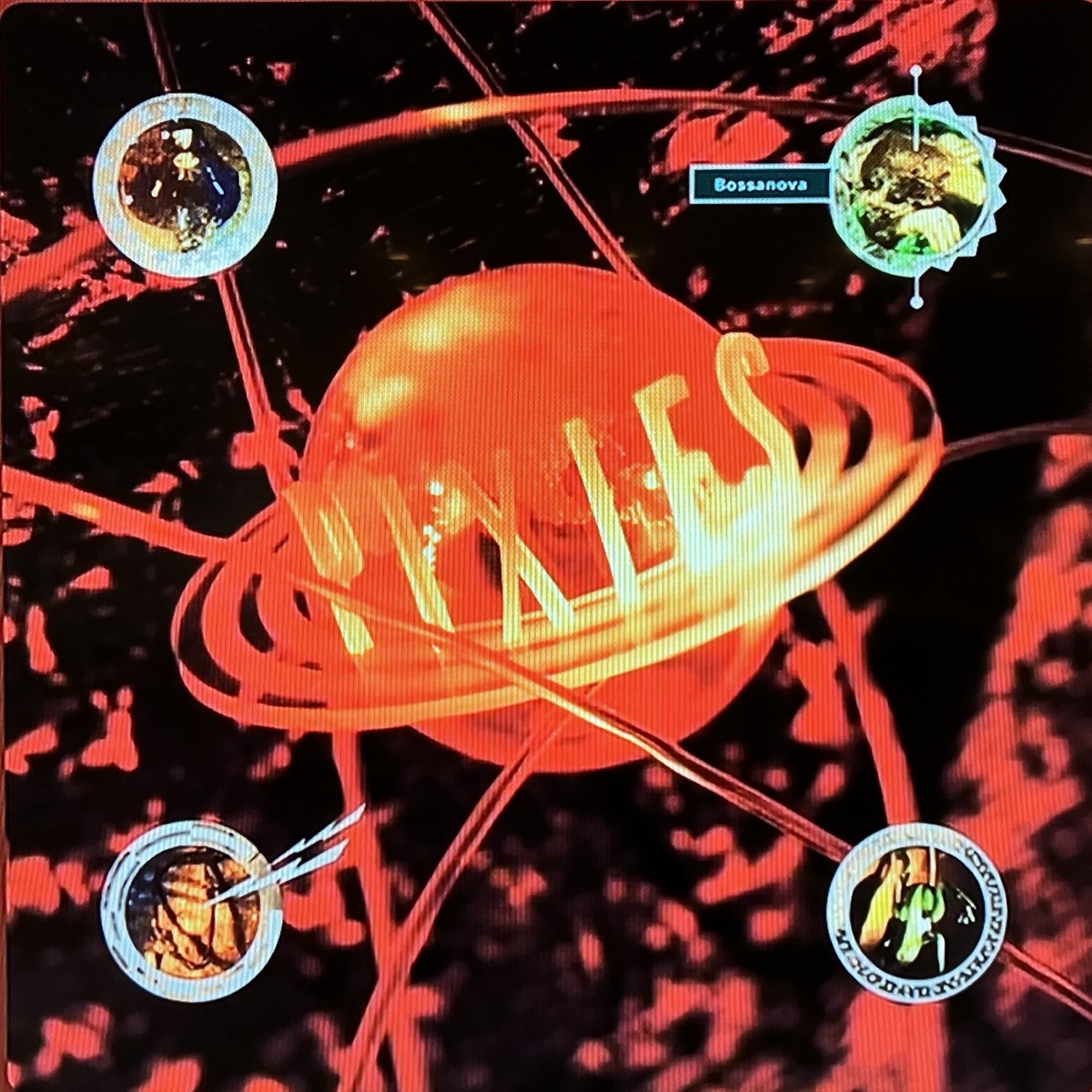 Snapshot of the cover art for Pixies’ fourth album Bossanova via mobile phone via streaming app on a TV box, thus the raster lines.
